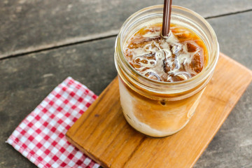 Close up ice latte coffee on wooden table
