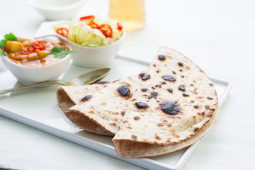 Indian tikka masala chicken and naan flat bread