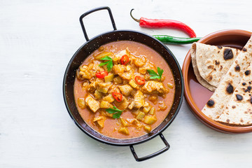 Indian tikka masala chicken and naan flat bread