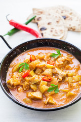 Indian tikka masala chicken and naan flat bread
