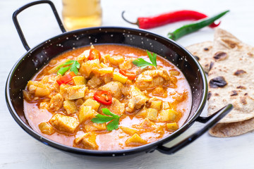 Indian tikka masala chicken and naan flat bread