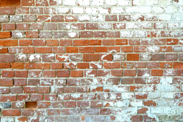 Old red brick wall as background horizontal view closeup