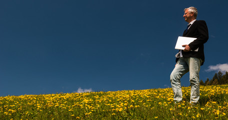 Man at work in a dandelion field