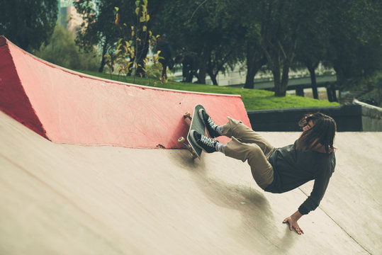 Skate Boarder Doing Tricks At Skate Park