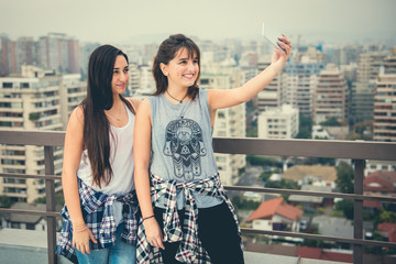 Modern Girlfriends in the city using a smart phone