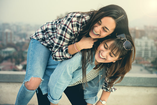 Two young urban girls at the city