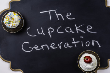 cupcakes on chalkboard written the cupcake generation