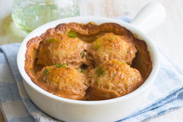 Meatballs cooked in tomato sauce