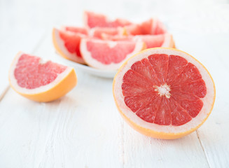Naklejka na ściany i meble Slices of fresh red grapefruit 