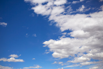 Fototapeta na wymiar Blue summer sky with white clouds