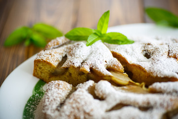 cake with pears in powdered sugar