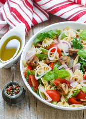 Warm salad of Farfalle with mushrooms and tomatoes 
