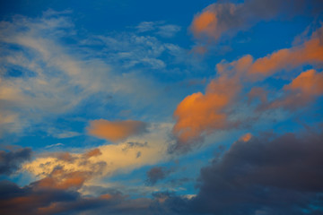 Fototapeta na wymiar Sunset orange clouds in a blue sky