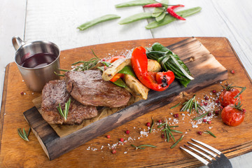 Steak with peas and vegetables