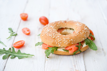 Bagels with arugula and a salmon
