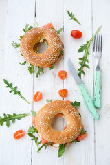 Bagels with arugula and a salmon

