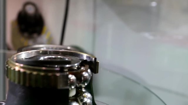 Various car and machinery bearings placed on display on spinning round glass shelf.Shallow depth of field.