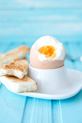 Boiled egg with wheat croutons
