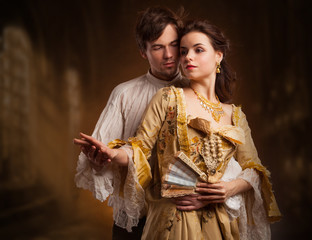 Beautiful couple woman and man in medieval clothes