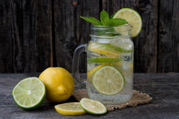  Homemade Cold lemonade with a lime and a lemon
