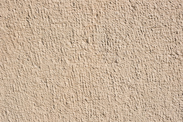interesting yellow facade plaster, special plaster structure