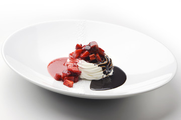 Dessert of whipped cream with chocolate cream and strawberries