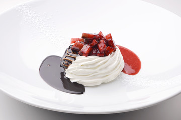 Dessert of whipped cream with chocolate cream and strawberries