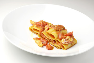 Dish of Paccheri pasta with seafood chowder sauce