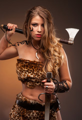 Medieval woman warrior with steel sharp axe in hands.