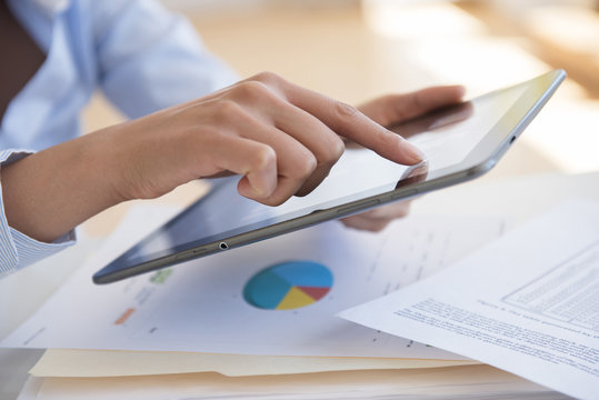 Hispanic businesswoman using digital tablet