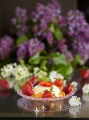 Spring dessert pannacotta with strawberries and flowers