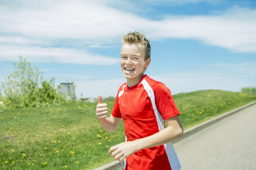 teen boy run outside in a day light