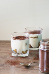 Classic italian dessert Tiramisu served in  glass. Selective focus.