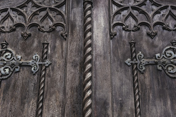 old dark wooden door with decorative elements.
