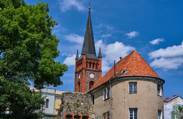 Fototapeta premium Turret and church tower with a clock in Niemcza.