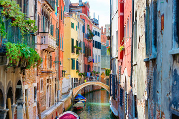 Fototapeta na wymiar Small canal between houses in Venice