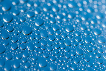 close-up of water drops on the blue background