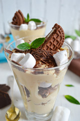 dessert with Oreo, marshmallow and caramel in a glass