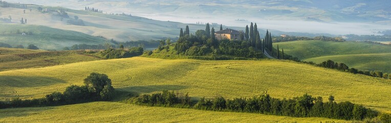 panoramic view to old villa in the morning  in Tuscany in Italy