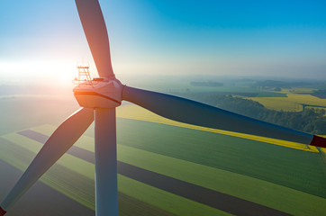 Sunset above the windmills on the field