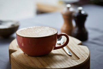 Сup of coffee on a table in cafe