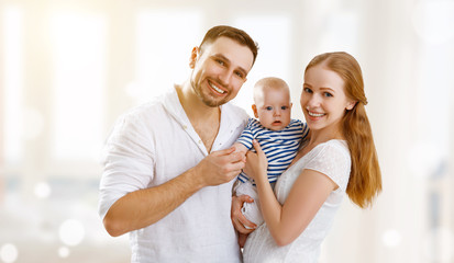 happy family mother, father and son, baby at home