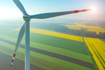 Sunset above the windmills on the field