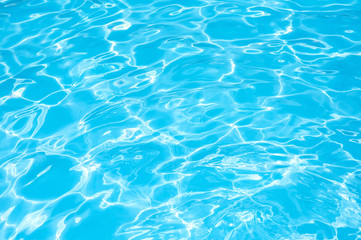 Blue water abstract, Blue water in swimming pool, Ripple water in swimming pool with sun reflection
