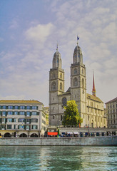 Grossmunster cathedral in Zurich from the riverside of the Limmat, Switzerland. 