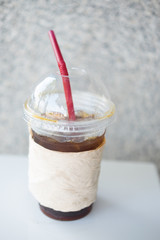 Black coffee with ice on table