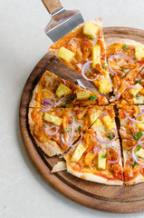 Hawaiian Chicken BBQ Italian Pizza on wood dish 