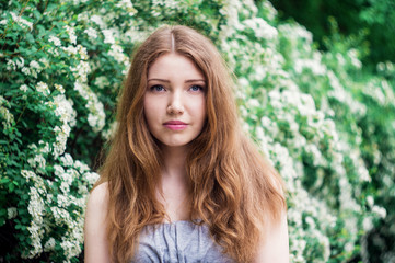 Beautiful young woman enjoying smell