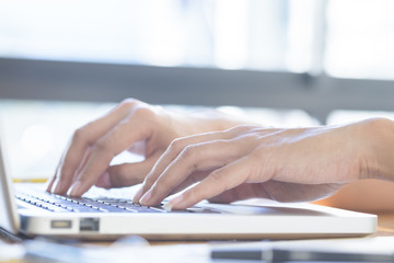Asian woman using laptop to online shopping.(selective focus)