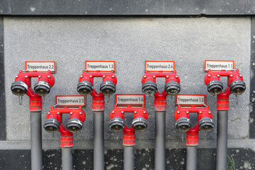 Red hydrants on an office building